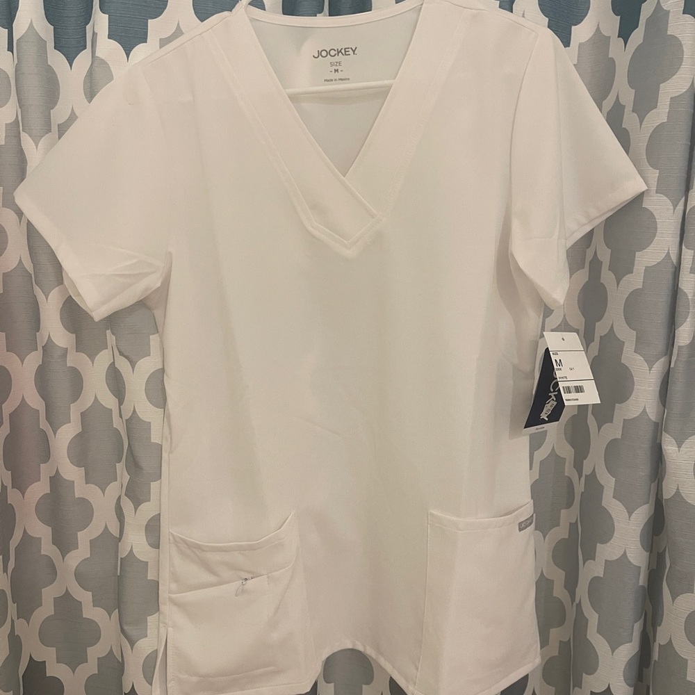 MAKE AN OFFER! White Jockey scrub top. NWT. Size Medium.